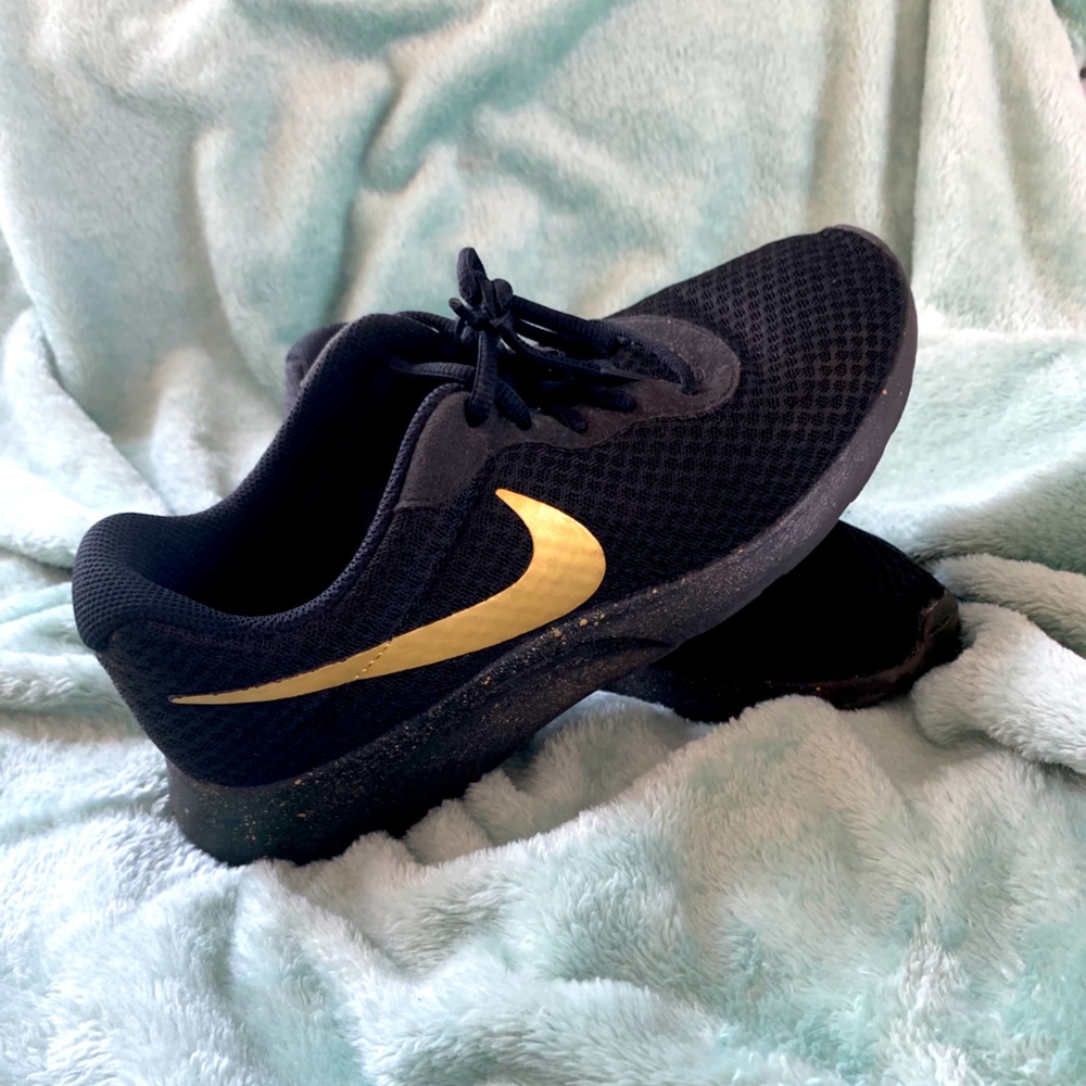 Black and gold Nike